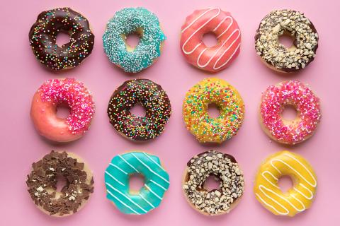 3 rows of donuts on a pink background