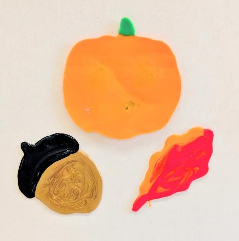 black and gold acorn, orange pumpkin, and orange and red leaf DIY window clings