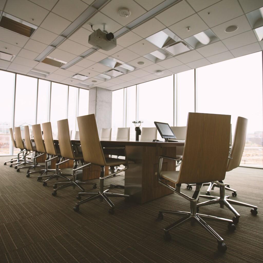 An empty board room set up for a meeting.